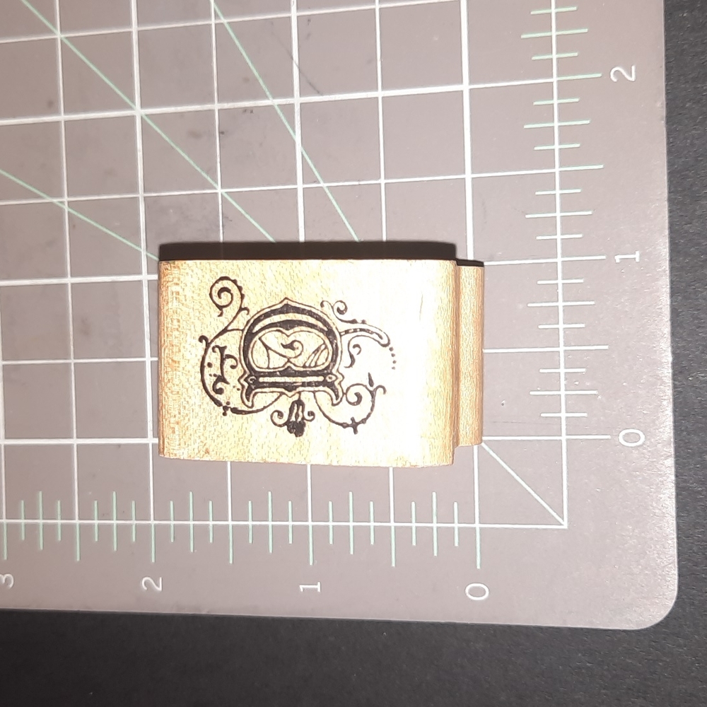 D Monogram rubber stamp.